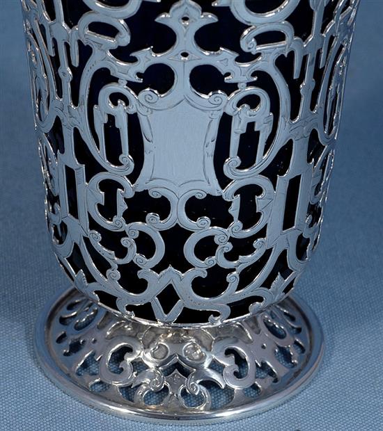 An early Victorian silver swing handled sugar basket and blue glass liner, Height: to handle 7 ¾”/195mm Top Dia 4”/100mm